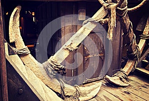 Ancient anchors on vintage ship photo