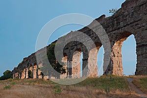 Ancient aqueducts at Parco Degli Acquedotti. Stone arches built to carry water into the city during Roman Empire. Outdoor park.