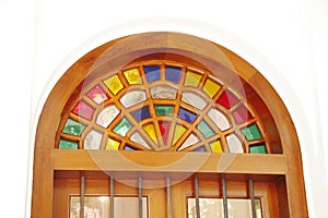 Ancient arabic designed colored glass arches above the door