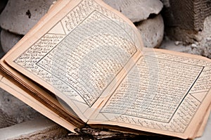 Ancient arabic manuscript with burnt pages