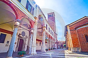 Ancient arcades and the bell tower of Basilica of Sant\'Ambrogio in Milan, Italy