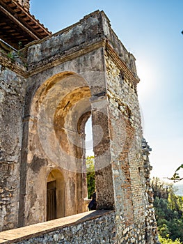 Ancient arch with a balcony in the garden at Villa D`Este in Tivoli, Italy