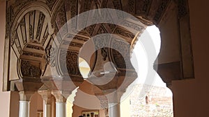 Ancient arches in Muslim palace of Nasrid style, Alcazaba, Malaga, Spain