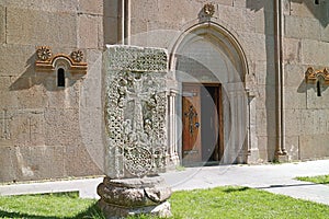 Ancient Armenian cross-stone called Khachkar in front of the Katoghike church in Kecharis medieval monastic complex, Armenia