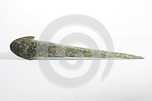 Ancient arrowhead isolated on a white background