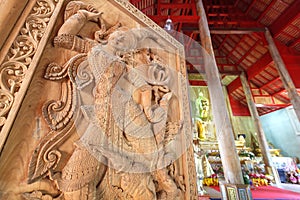 Ancient art pattern on the wooden door in Thai temple