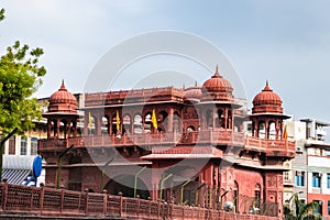 ancient artistic holy jain temple entrance with cloudy sky at morning