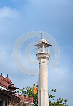 ancient artistic holy jain temple holy pillar with cloudy sky at morning