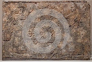 Ancient assyrian relief depicting winged gods or s