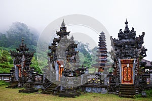 Ancient Balinese hindu temple at Buyan lake in mountain rainforest