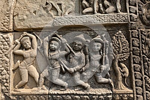 Ancient bas-relief on the wall of the famous Angkor temple.