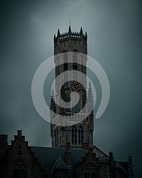 Ancient Belfry of Bruges in Belgium in a cloudy day