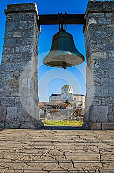 Ancient bell against church