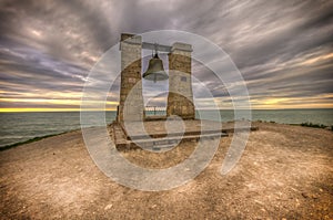 Ancient bell at sunset