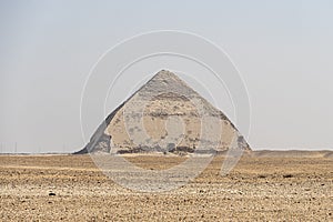 ancient Bent Pyramid of Dahshur for Pharaoh Snefru, near Cairo, Egypt. The southern pyramid in Dahshur is called cut or diamond-