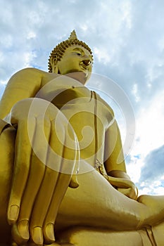 Ancient Big Buddha Image in the Field at Muang Temple , Ang Thong in Thailand