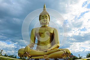 Ancient Big Buddha Image in the Field at Muang Temple , Ang Thong in Thailand