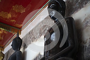 Ancient Black Buddha at Wat Suthat Thep Wararam is a Buddhist temple in Bangkok, Thailand