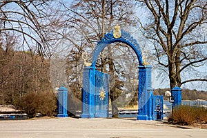 Ancient blue gate as an entrance to Royal Djurgarden Kungliga Djurgarden in Stockholm