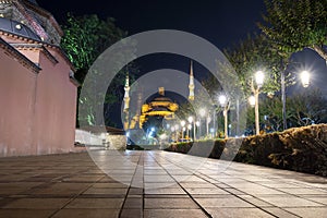 The ancient Blue Mosque illuminated in Sultanahmet Square at night in Istanbul, Turkey.