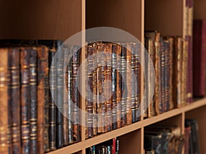 Ancient books on a a book shelves