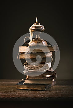 Ancient books and candle