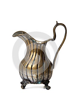 Ancient brass ewer on white