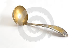 Ancient brass soup spoon