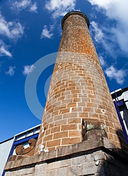 Ancient brick pipe in the old sugar cane factory. Mauritius.