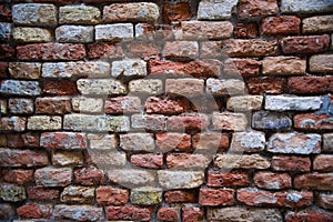 Ancient brick wall. The masonry of bricks closeup