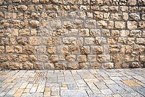 Ancient brick wall and pavement of old city of Jerusalem, Israel