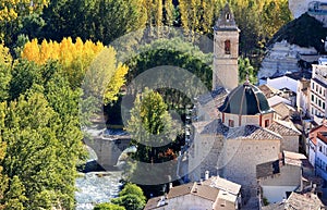 Ancient bridge ande church in Alcala del Jucar photo