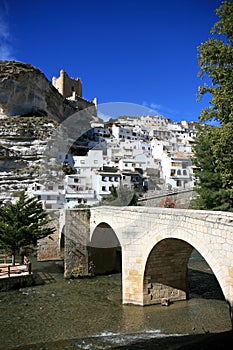 Ancient bridge and castle in Alcala del Jucar photo