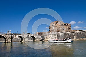 Ancient bridge and castle along river in Rome