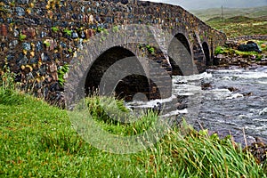 Ancient bridge crossing a wild river