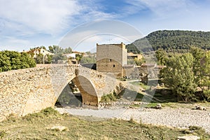 Ancient bridge over las Truchas river in Pobleta de San Miguel village, Villafranca del Cid, province of CastellÃÂ³n, Spain photo