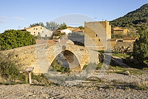 Ancient bridge over las Truchas river in Pobleta de San Miguel photo