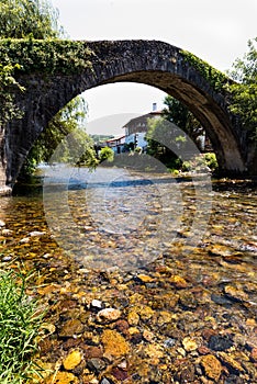 Ancient bridge over the River Nive at St Etienne de BaÃ¯gorry,