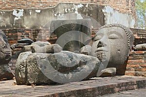 Ancient broken Buddha head with serene expresssion