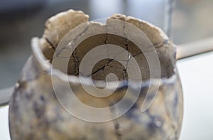 Ancient broken clay bowl pasted by archaeologists