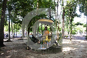 Ancient buddha and antique deity old angel in garden park of Wat Khuan Maphrao temple for thai people travelers travel visit and