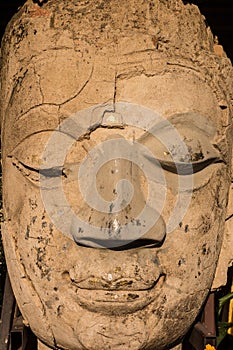 Ancient Buddha face statue