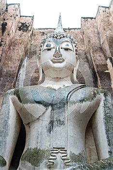 ancient buddha statue (Phra Achana) in Wat Si Chum (Buddhist temple). Sukhothai Historical Park, Sukhothai, Thailand