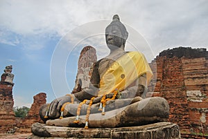 Ancient Buddha statue in Wat Phra Mahathat temple, in Phra Nakhon Si, Ayutthaya Historical Park, Thailand