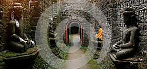 Ancient Buddha statues in orange cover