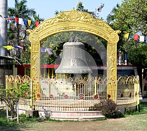 Ancient Buddhist bell next to the temple at Sarnath, the place of Buddha`s first sermon near Varanasi. India
