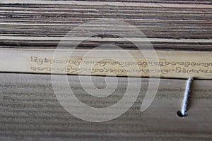 Ancient Buddhist mantras on bamboo leaves