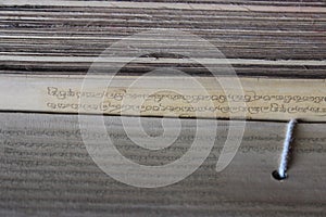 Ancient Buddhist mantras on bamboo leaves photo