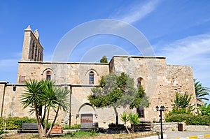 Ancient building of Bellapais Abbey in small Cypriot city Bellapais in Turkish part of Cyprus with blue sky above