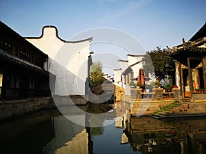 Ancient building reflecting on the peaceful river